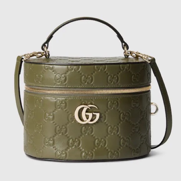 Gucci Handbags - Gucci GG embossed leather vanity bag